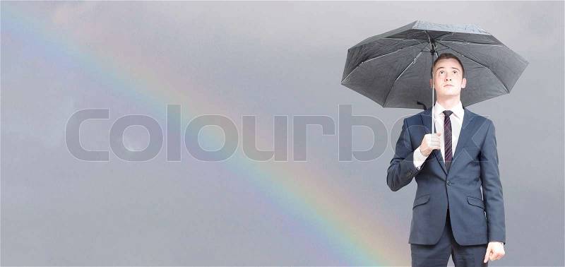 Worried business man on a rainy day, stock photo