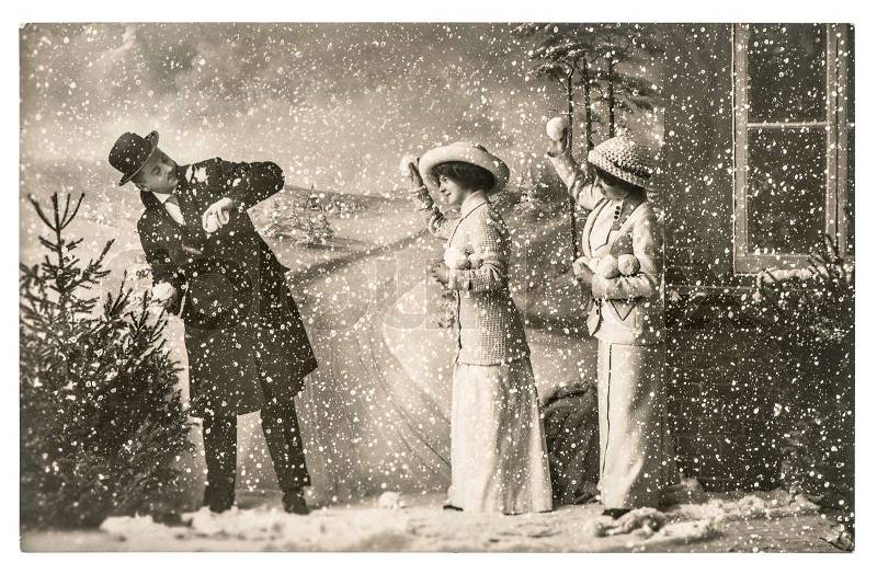 Happy young people playing in snow. vintage christmas holidays picture with original scratches and film grain, stock photo