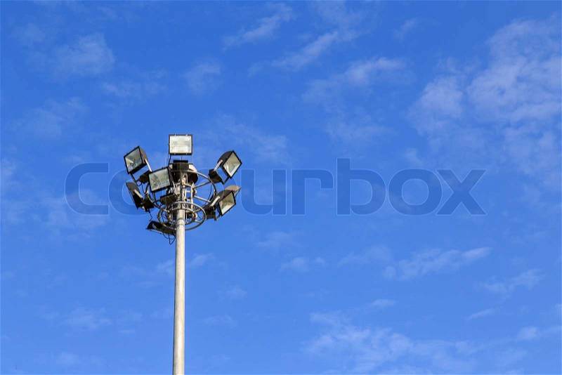 Spot light pole with blue sky in the park, stock photo