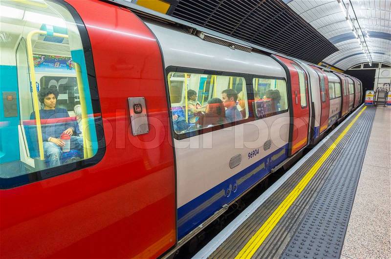 LONDON - SEPTEMBER 28, 2013: Subway train in underground station. London subway system serves 270 stations and has 402 kilometres (250 mi) of track, stock photo