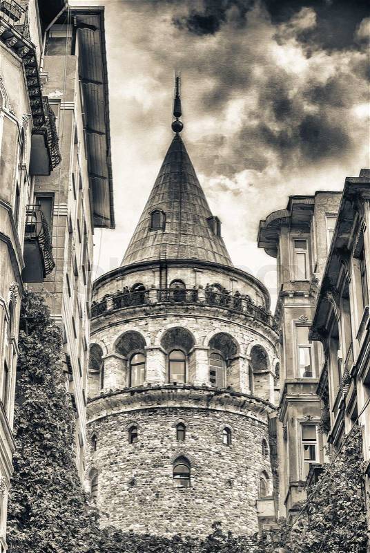 Galata Tower framed by ancient buildings - Istanbul, Turkey, stock photo