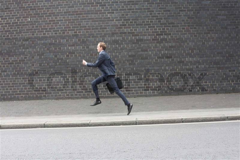 Business man running, stock photo