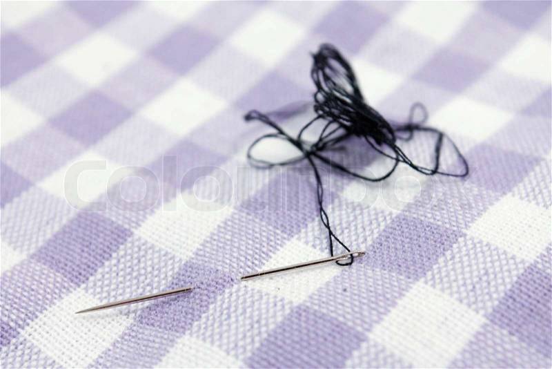 Needle and thread, stock photo