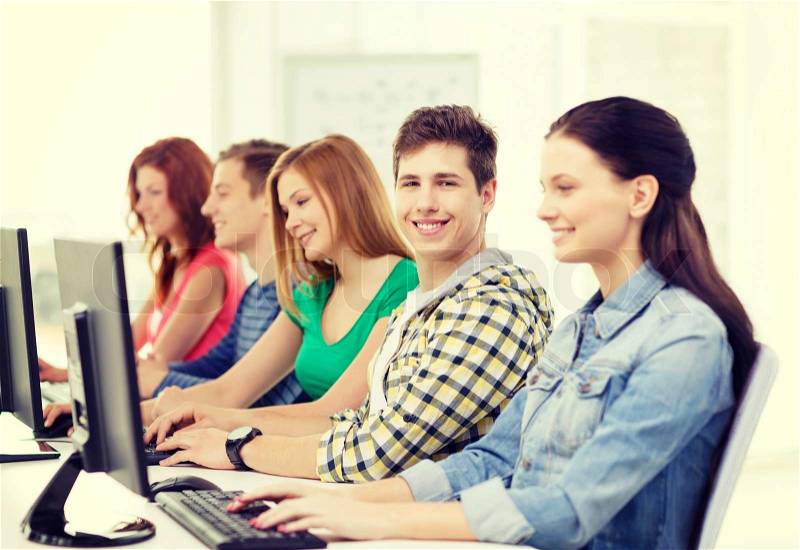 Education, technology and internet - smiling male student with computer studying at school, stock photo