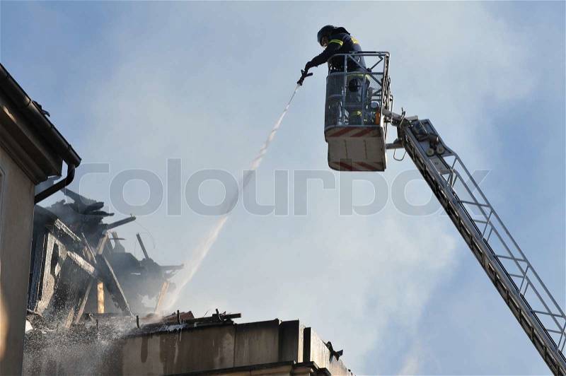 Stock image of 'fire, building, firemen'