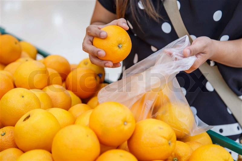 Woman shopping in department store, stock photo