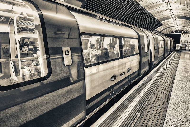 LONDON - SEPTEMBER 28, 2013: Subway train in underground station. London subway system serves 270 stations and has 402 kilometres (250 mi) of track, stock photo