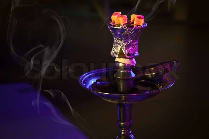 Fragment of hookah with burning coals in the night club of Manama, Bahrain, stock photo