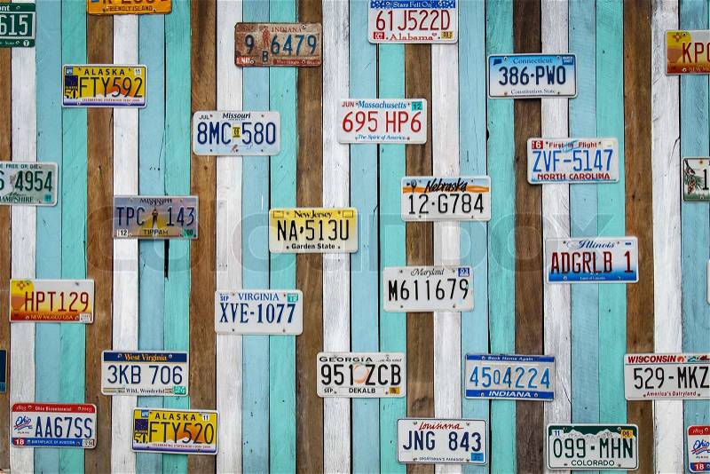 CHA AM THAILAND- AUG 11 : Old US car registration plate on wooden wall at the shop in Cha Am August 11, 14, Cha Am is a beach resort town in Phetchaburi Province, in the way to southern of Thailand, stock photo