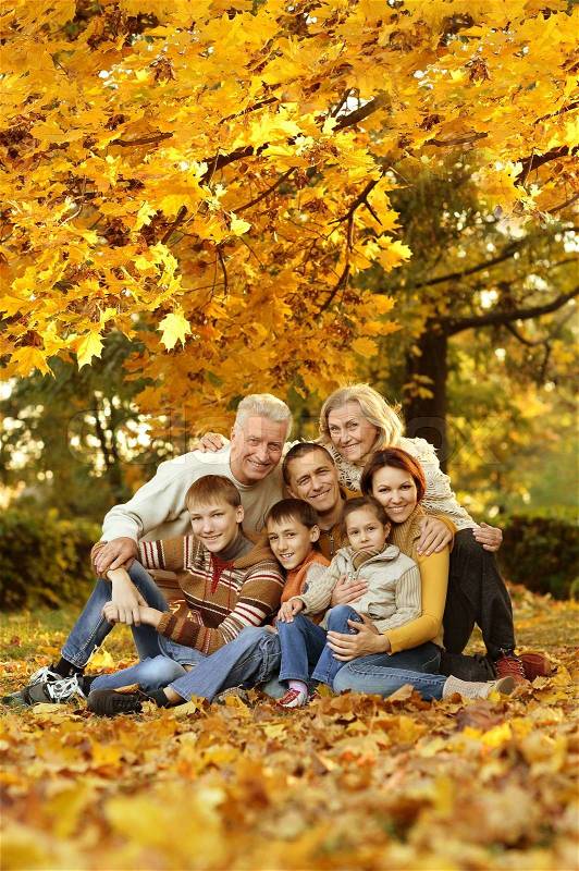 Nice large family relaxing in autumn park, stock photo