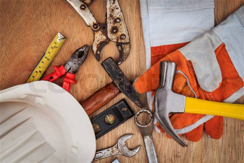 Closeup of assorted work tools on wood, stock photo