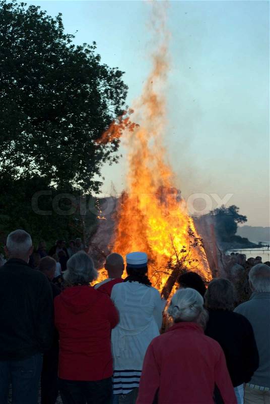Midsummer bonfire and people, stock photo
