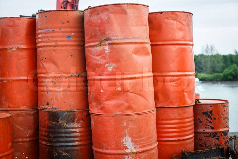 Close up stack of old red barrel or oil-drums, stock photo