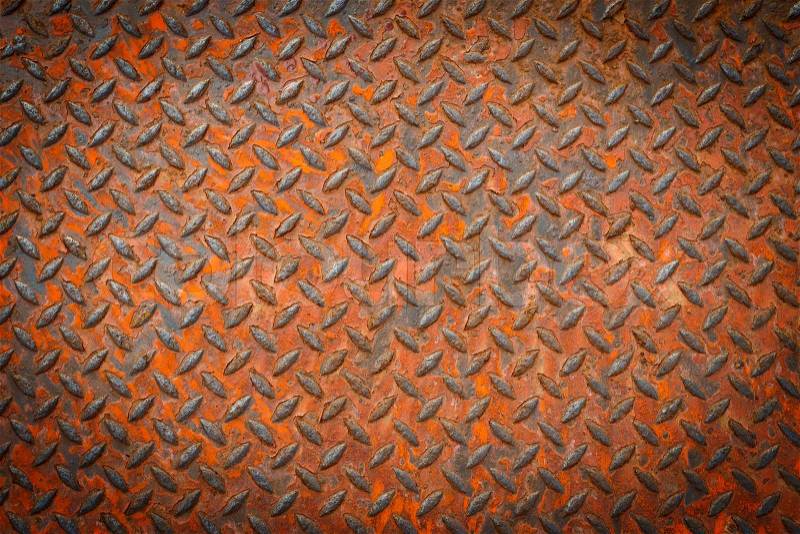 Background of metal diamond plate in red color with rusty, stock photo