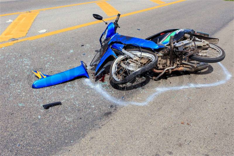 SURATTHANI - JULY 18 : Motorcycle accident on the road and crashed with other car which causing the rider serious injury on July 18, 2014 in Suratthani, Thailand, stock photo