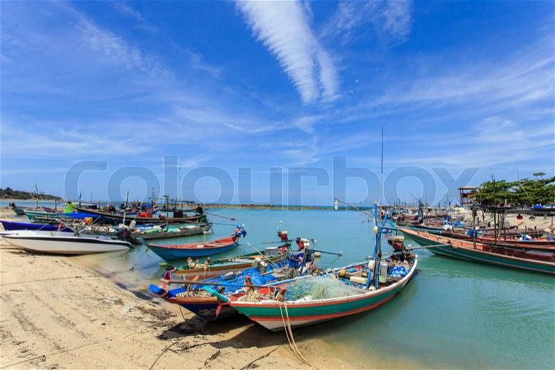 Traditional Thai boat or long tail boat stand at the beach, stock photo
