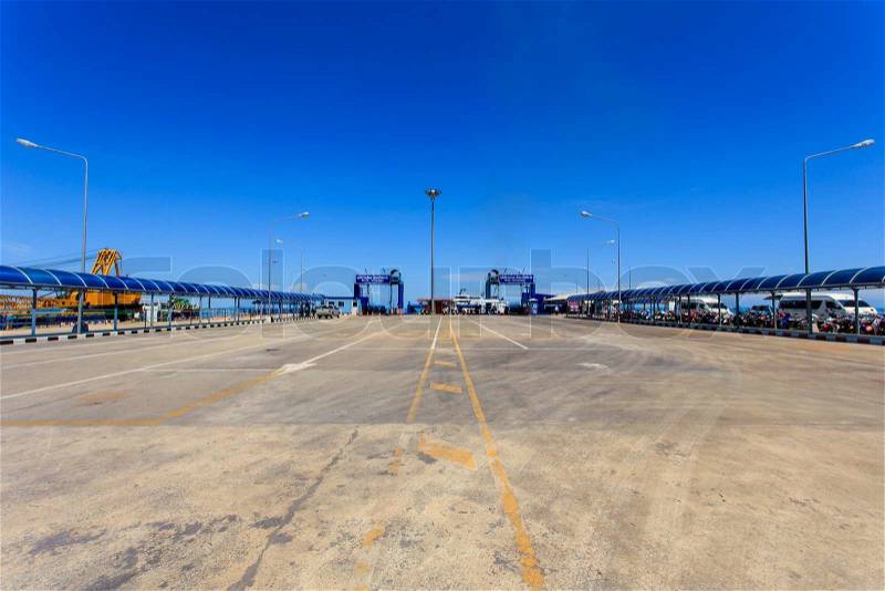 SURATTHANI - JULY 16 : A long ferry concrete pier. The main pier of transportation from Samui island to Donsak pier and from Donsak pier to Samui island on July 16, 2014 in Suratthani, Thailand, stock photo