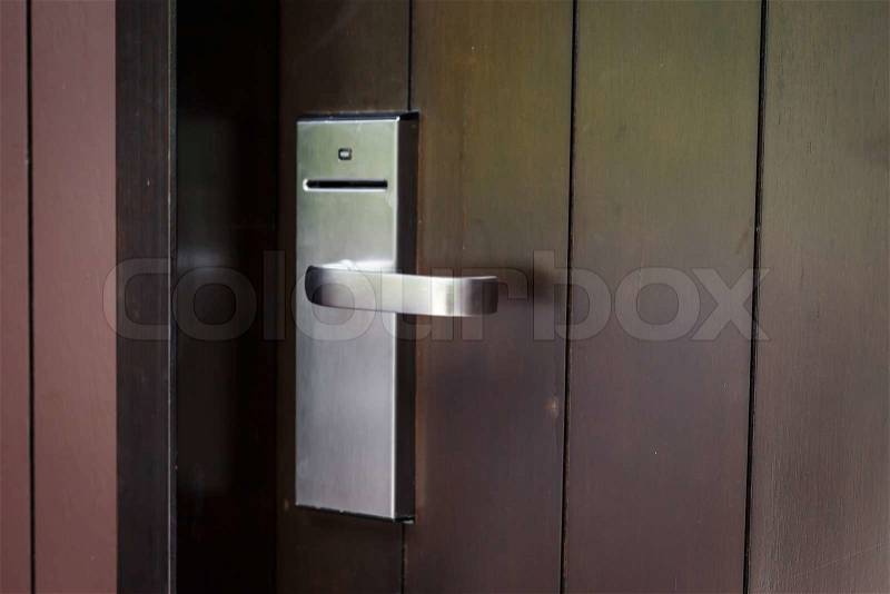 Entrance door with electronic keycard lock system, stock photo