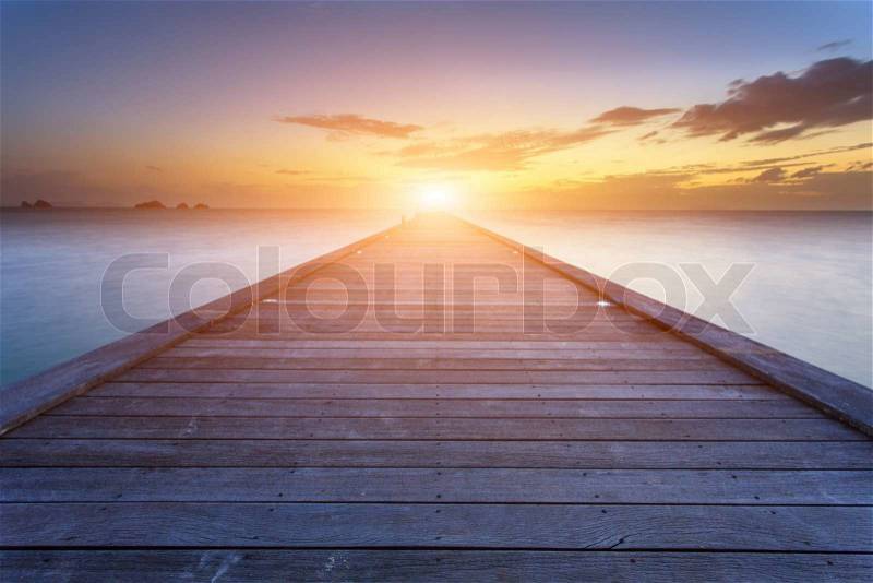 Wood bridge to the sea at sunset beach in Koh Samui, Thailand, stock photo