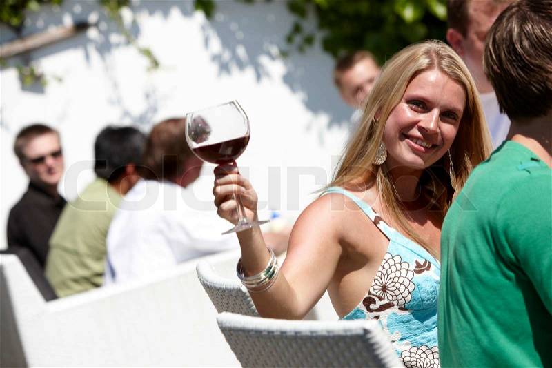 A smiling blond woman enjoying a hot summer day, stock photo