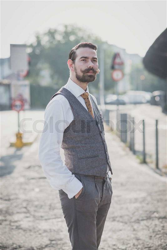 Handsome big moustache hipster man in the city, stock photo
