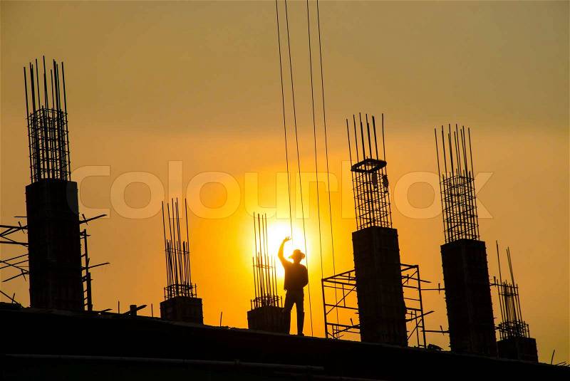 Silhouette of man working for building, stock photo