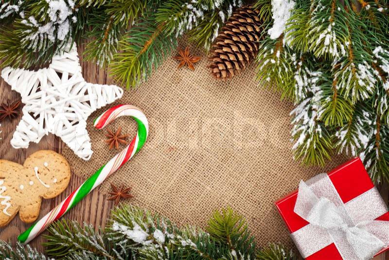 Christmas food, decor and gift box with snow fir tree background with copy space, stock photo