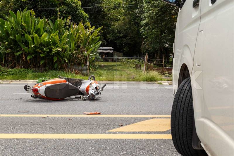 PHUKET, THAILAND - NOVEMBER 3 : Van accident on the road and crashed with motorcycle which causing the rider serious injury. November 3, 2014 in Phuket Thailand, stock photo