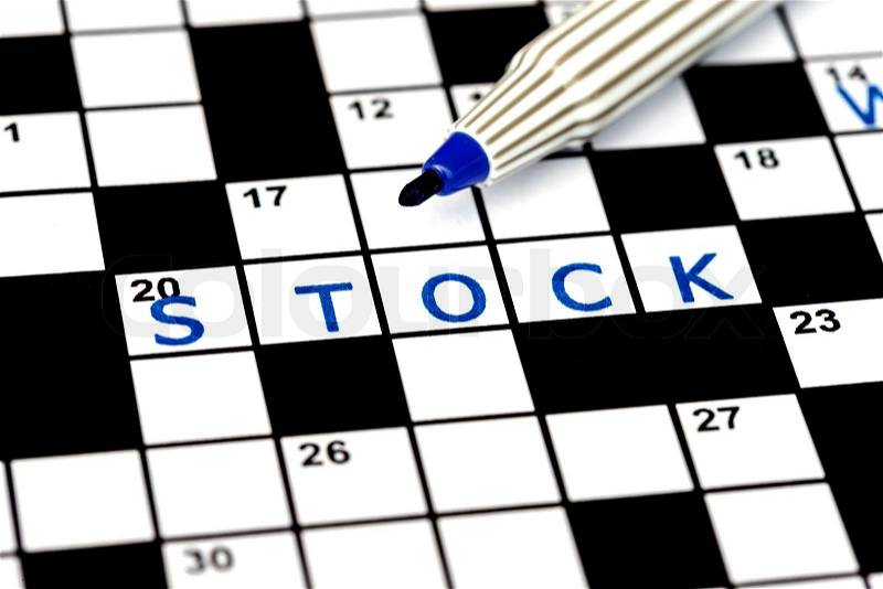 Stock in solving crossword puzzle, close up, stock photo