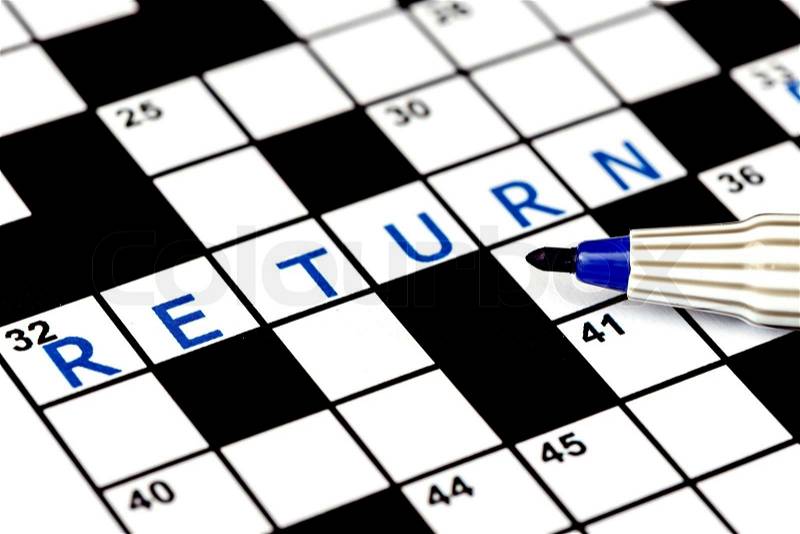 Return in solving crossword puzzle, close up, stock photo