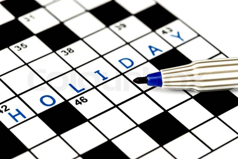 Holiday in solving crossword puzzle, close up, stock photo