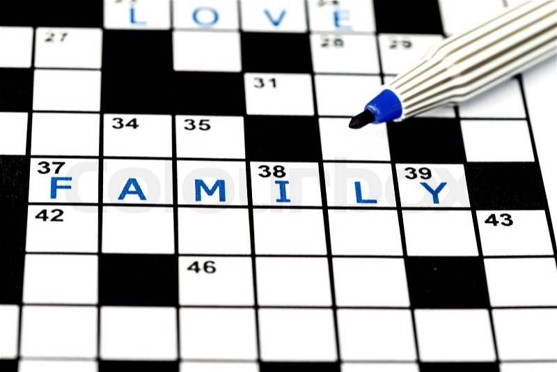 Beach in solving crossword puzzle, close up, stock photo