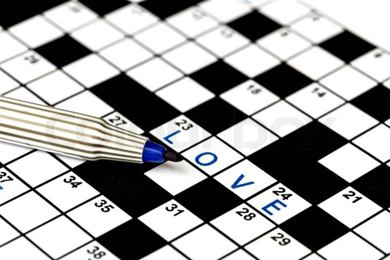 Love in solving crossword puzzle, close up, stock photo