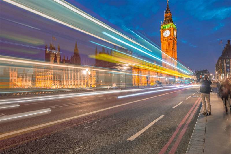 Traffic on Westminster Bridge with car light trails, stock photo