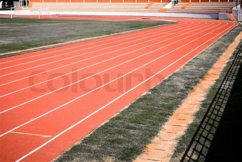 Track and field for running sport in stadium, stock photo