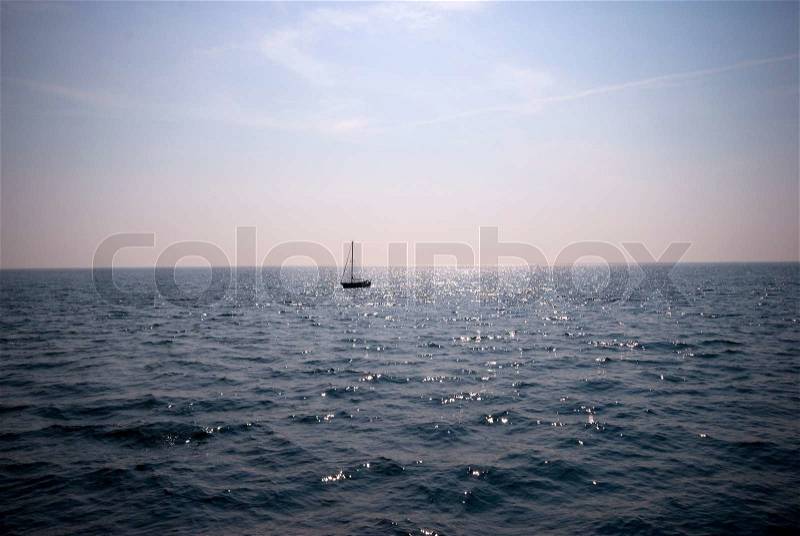 Sailboat on the blue ocean. View from Helgoland Island in the North Sea, stock photo