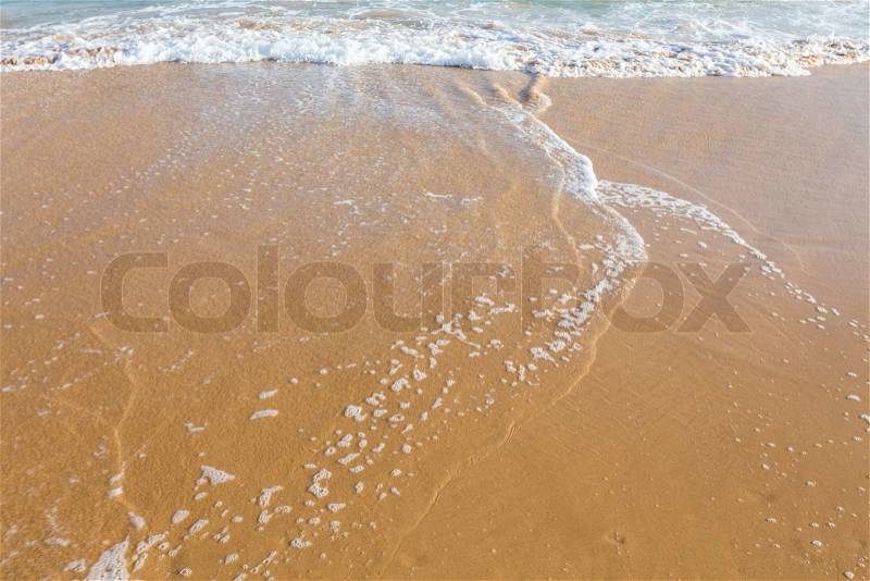 Beautiful clear mediterranean water lapping on the shore, stock photo