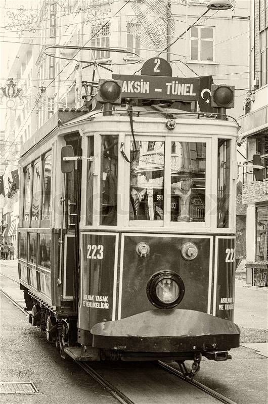 ISTANBUL, TURKEY - SEPTEMBER 21, 2014: The old tram and people walking in Istiklal Caddesi on September 21, 2014 on Istanbul, Turkey, stock photo