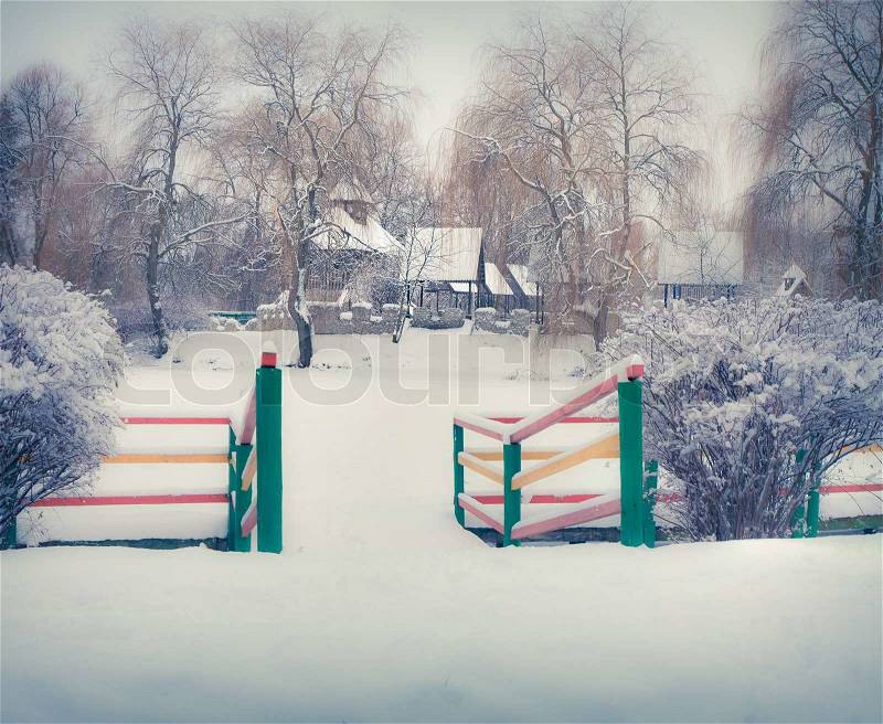 Snow-covered landscape in the city park. Retro park, stock photo