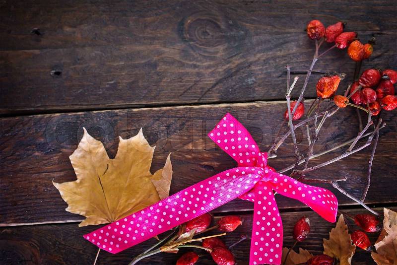 Florist table for Making autumn decorations with leafs,shears and ribbon, stock photo