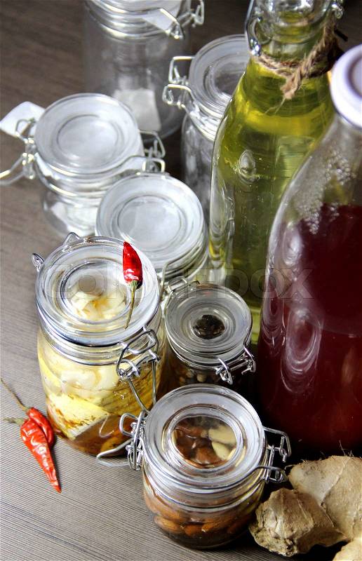 Mix of homemade canned delicious food in the beautiful jars , stock photo