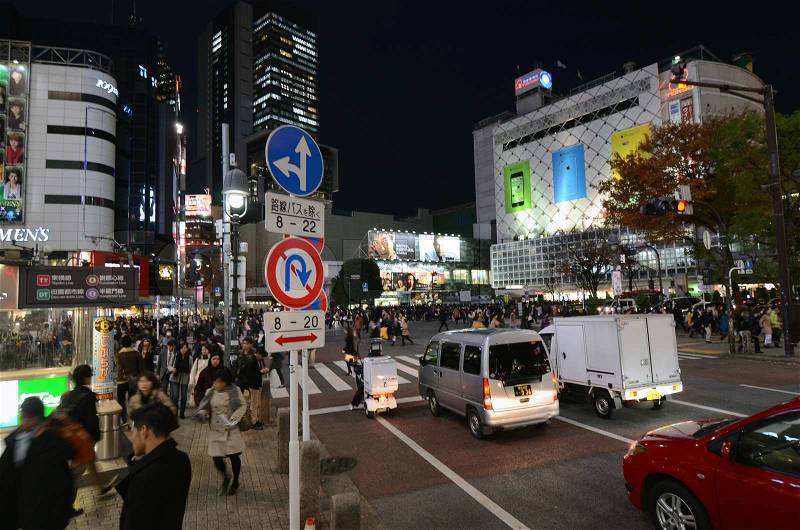 Tokyo, Japan - November 28, 2013: Pedestrians at the famed crossing of Shibuya district on November 28, 2013 in Tokyo, Japan. Shibuya is a fashion center and nightlife area. , stock photo