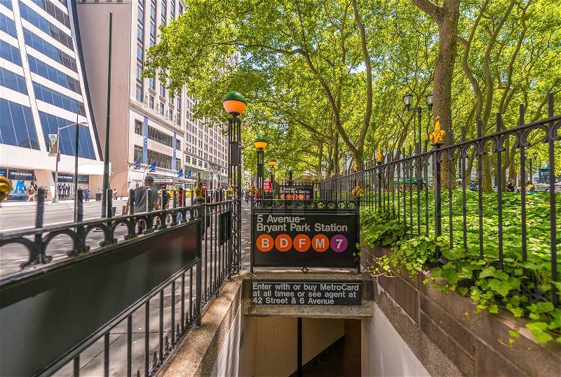 NEW YORK CITY - MAY 15, 2013: Subway entrance in Midtown Manhattan. Owned by the NY City Transit Authority, the subway has 469 stations in operation, stock photo