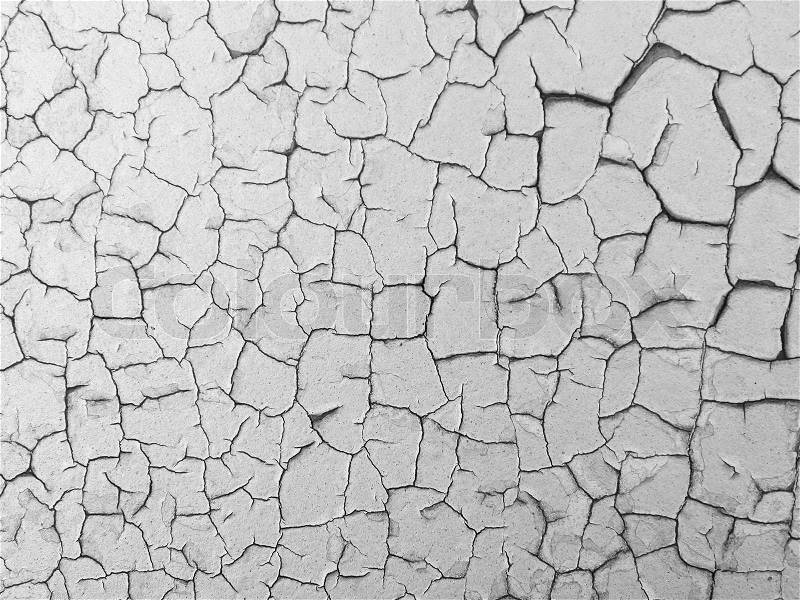 Close-up detail of cracked paint on rusty metal wall, stock photo