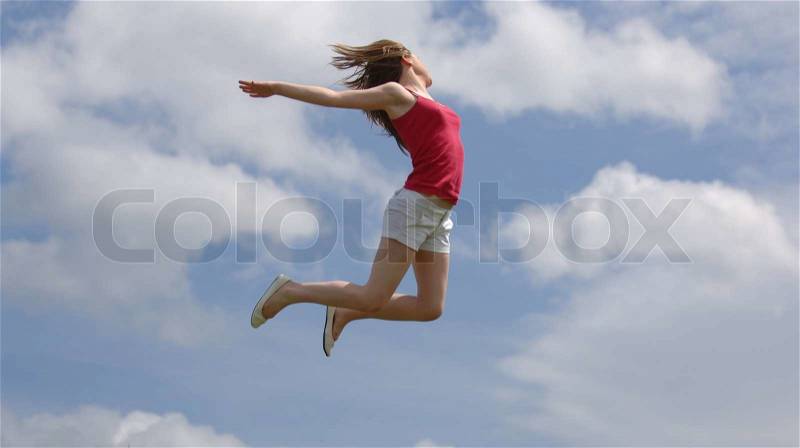 Very Attractive Teenager Jumping for Joy, stock photo