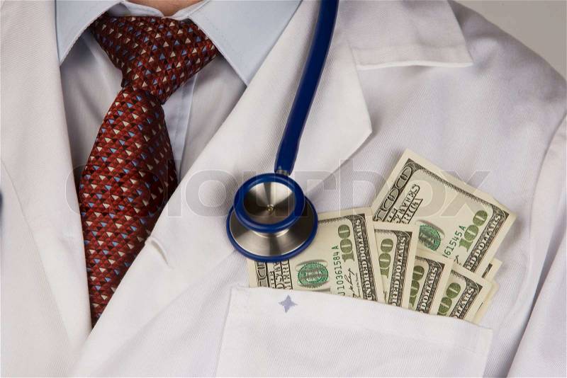 A doctor with a stethoscope and U.S. dollars banknotes, stock photo