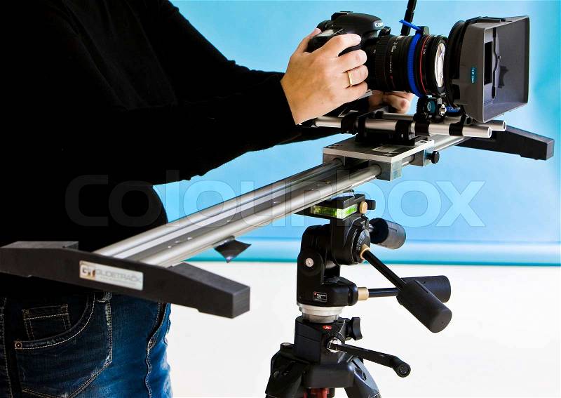 A photographer in a studio with high-end camera for photoshoot (stock photo), stock photo