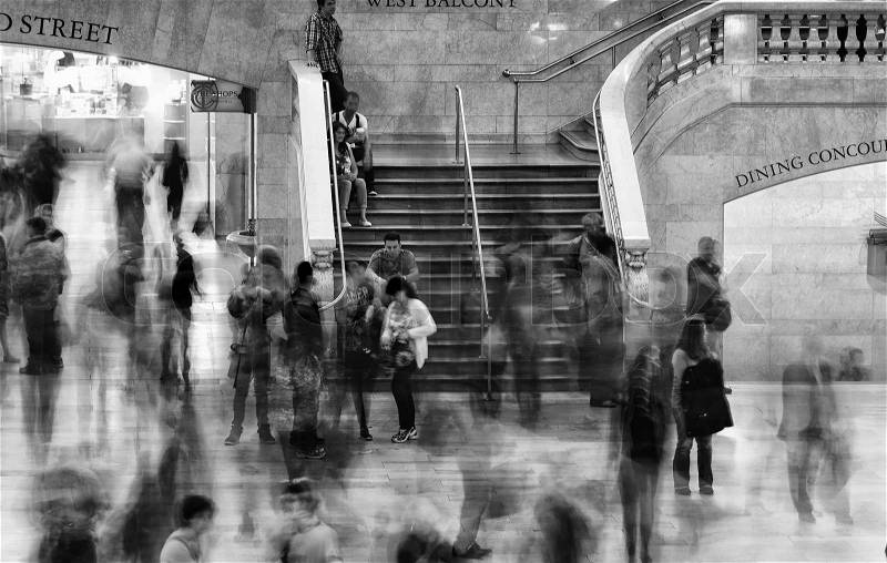 NEW YORK CITY - MAY 20: Fast moving commuters inside Grand Central Station on May 20, 2013 in New York City, NY. The terminal is the largest train station in the world by number of platforms having 44, stock photo