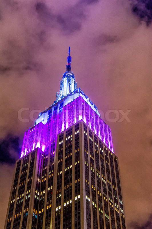 NEW YORK CITY - MAY 21, 2013: Illuminated top of Empire State Building at night. It stood as the world\'s tallest building for more than 40 years (from 1931 to 1972), stock photo