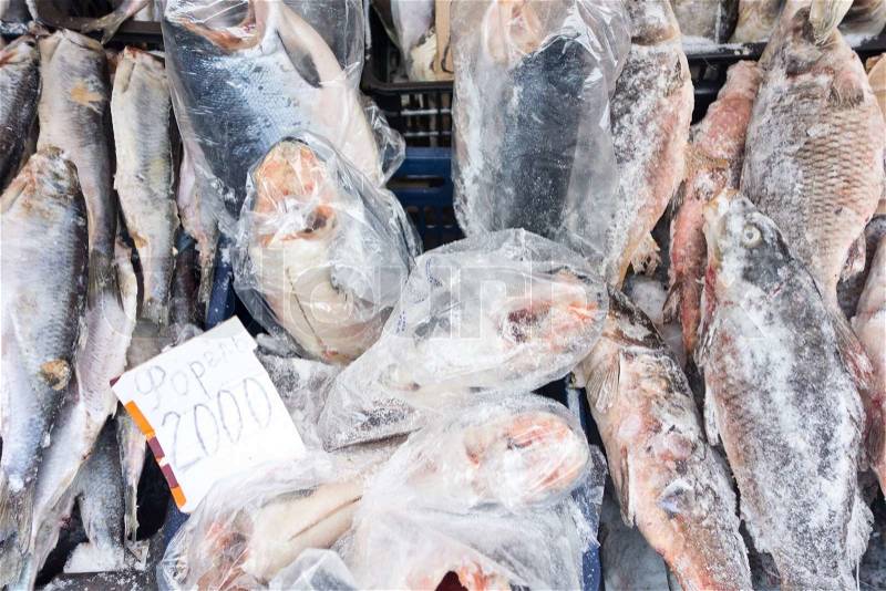 Raw frozen fish on a local market, stock photo